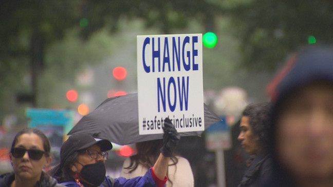 A sign saying "Change Now" that was held at a march in honor of Eiwa Kwon, a pregnant Seattle restaurant owner who was murdered in the Belltown neighborhood on June 13, 2023. (KOMO)
