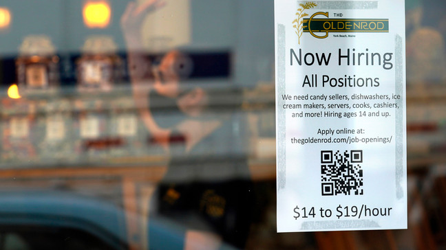 FILE - A sign advertises for help The Goldenrod, a popular restaurant and candy shop, Wednesday, June 1, 2022, in York Beach, Maine. (AP Photo/Robert F. Bukaty, File)