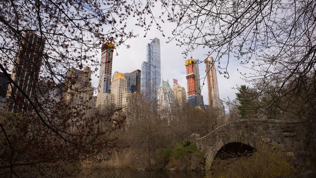 FILE - Skyscrapers overlook Central Park and Gapstow Bridge, April 17, 2018, in New York. (AP Photo/Mark Lennihan, File)
