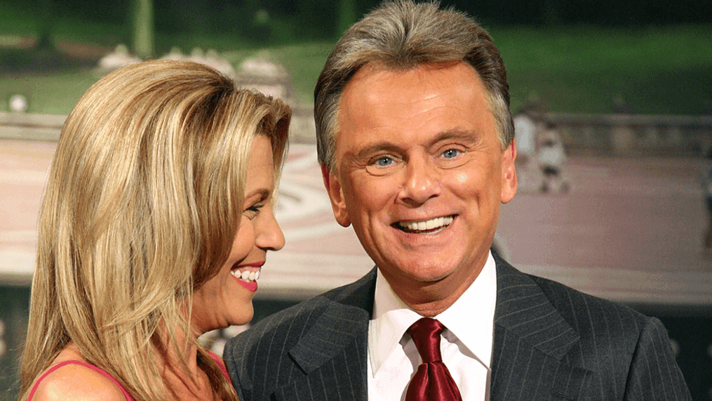 Host Pat Sajak (R) and co-host Vanna White pose for photos during a taping of "Wheel Of Fortune Celebrity Week" celebrating the television game show's 25th anniversary at Radio City Music Hall on September 29, 2007 in New York City.  (Photo by Astrid Stawiarz/Getty Images)